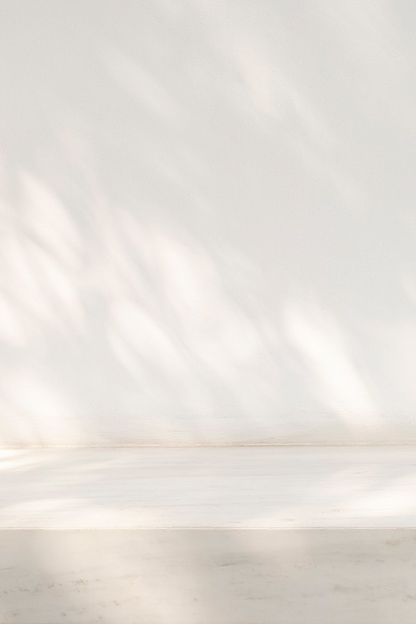 Abstract shadows on a textured dark surface.