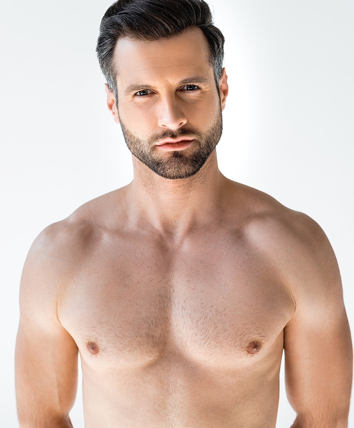 male breast reduction patient model with a well-groomed beard and strong build.