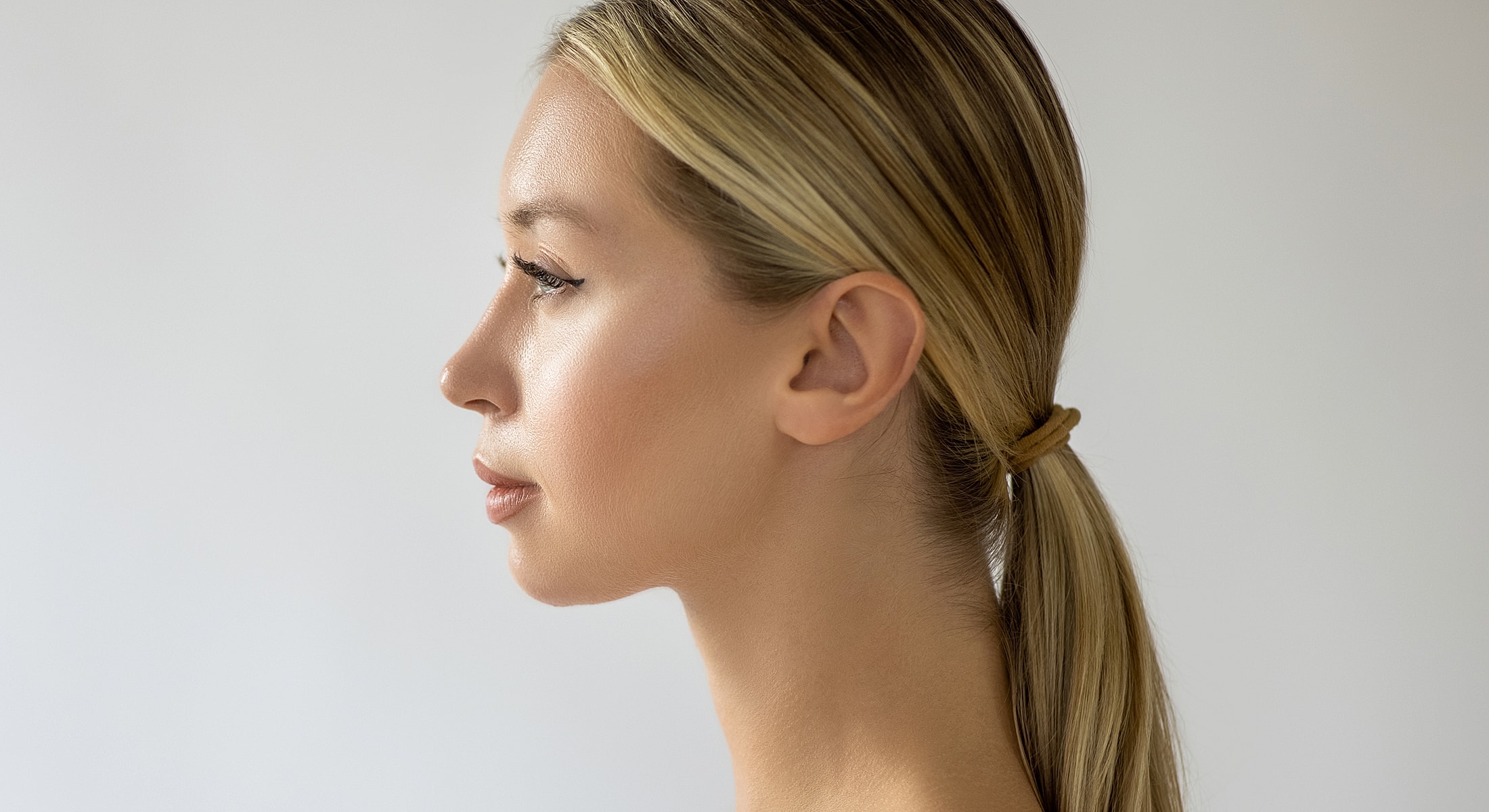 Profile view of a woman with long hair.