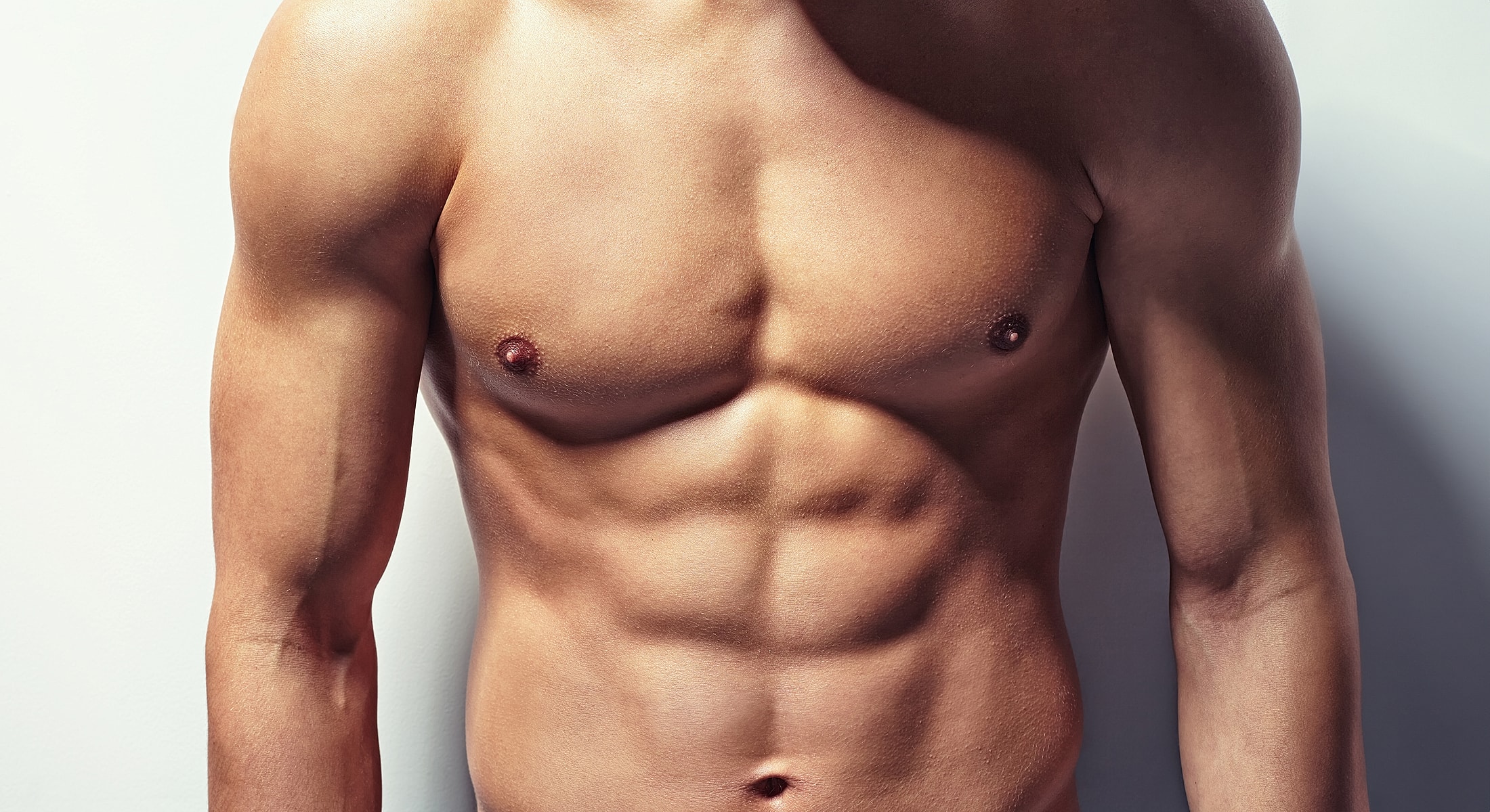 male breast reduction patient model with defined abs and muscular arms